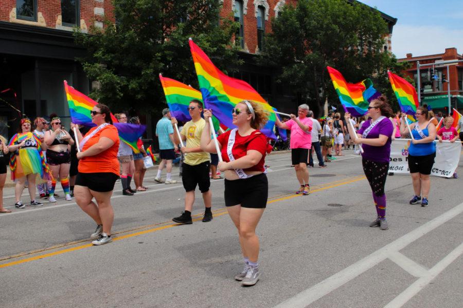 Parade participants perform a flag routine with pride flags during the Des Moines Pride Parade on June 9. The parade started at the Iowa Capitol Building and traveled down Grand Avenue in the East Village. 