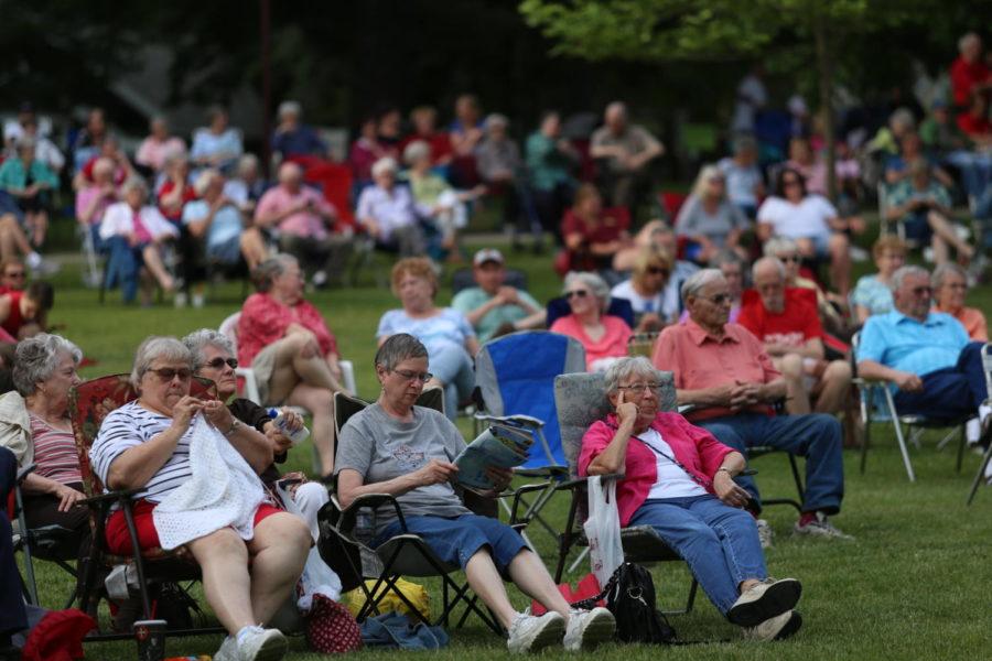 Members of the community gather around the Durham Bandshell on June 6 for the first night of performances by the Ames Municipal Band. 