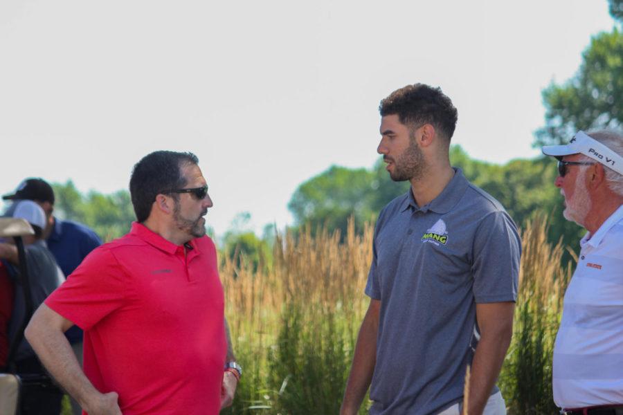 Former Iowa State men’s basketball player Georges Niang talks with current men’s basketball head coach Steve Prohm before Niang’s golf outing on July 29 at Ames Golf and Country Club. Prohm coached Niang during his junior and senior year at Iowa State, during which Niang passed 2,000 points scoring and was named 2015 Big 12 Tournament MVP. 