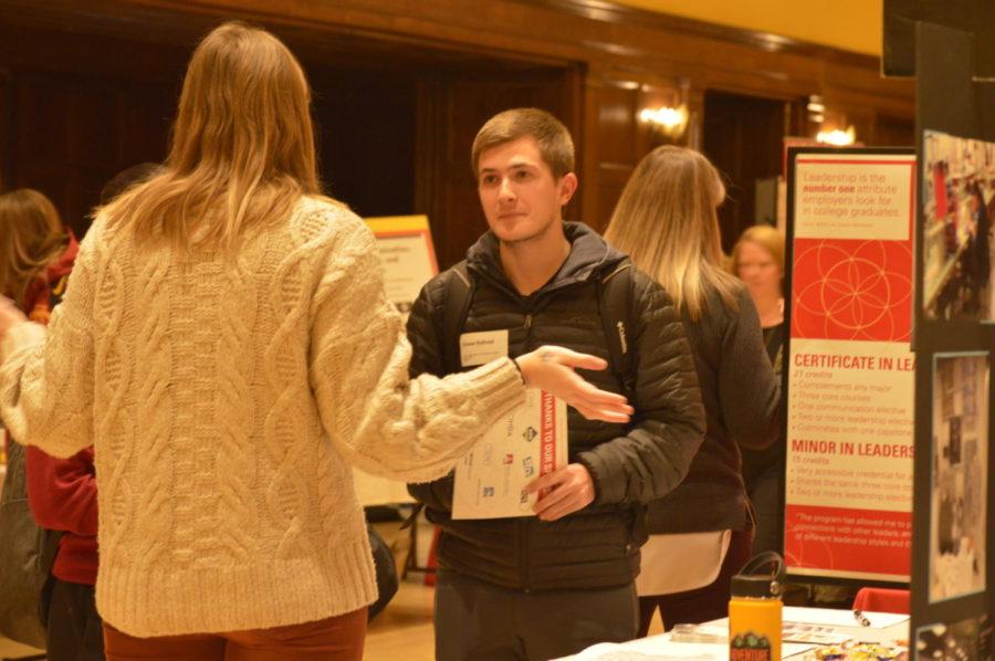 Chase Kaltve, senior in biology, learns about study abroad opportunities offered through Iowa State. The study abroad center has over 700 different opportunities students can take advantage of. The Study Abroad Fair was held in the Great Hall of the Memorial Union on Jan. 24 and allowed students to ask questions and learn more about these opportunities.