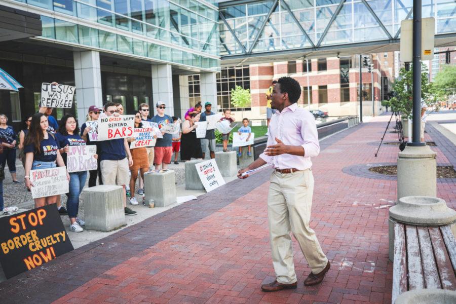 The border violence protest organizer, Dozmen Lee, presents a speech to the crowd on July 3 in front of the Neal Smith Federal Building in Des Moines. 