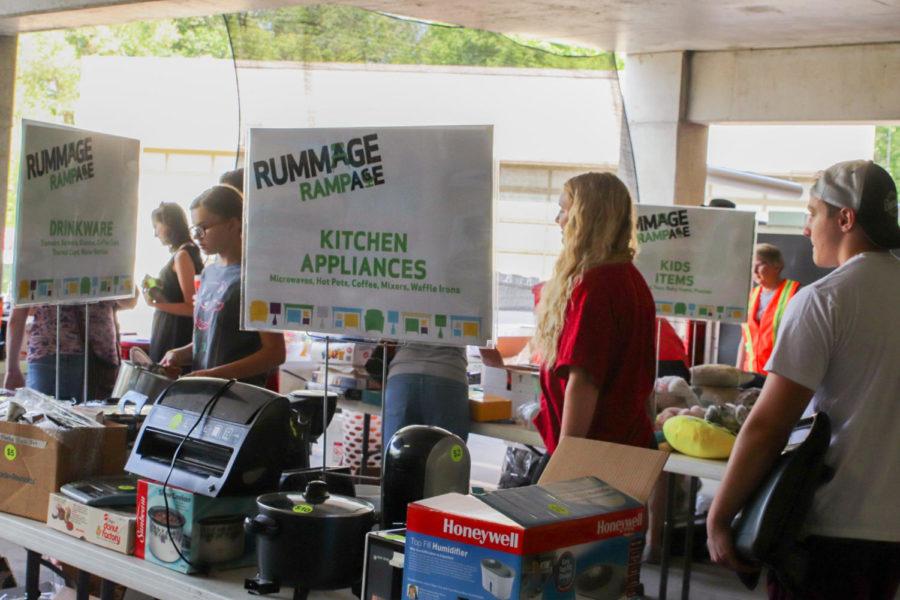Patrons browsing a table marked kitchen appliances at the Ames City Rummage Rampage at the Ames Intermodal Facility on July 27. The event runs from July 27th to Aug. 3.