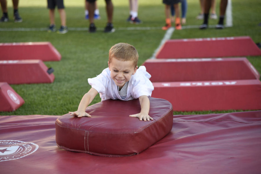 Kids were given the change to run drills and make touchdowns during Victory Day on the MidAmerican Energy Field at Jack Trice Stadium on Aug. 23. Victory Day gives local children with disabilities the opportunity to meet and play with members of the Iowa State football team.