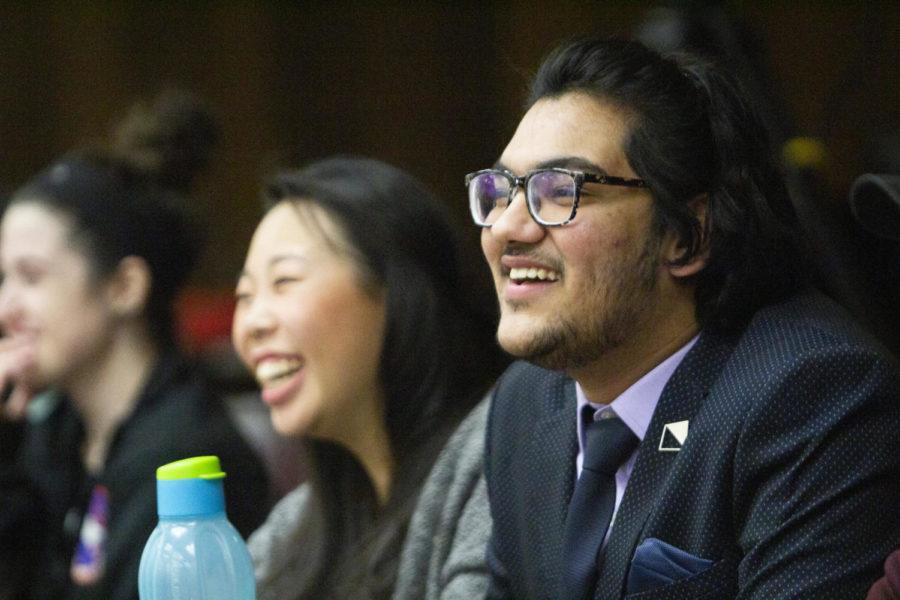 Austin Graber’s running mate Vishesh Bhatia and Iowa State student Bethany Fingerle smile as Graber answers a question during the Iowa State Student Government Presidential Debate. The debate was held Feb. 26 in the Campanile Room of Memorial Union.