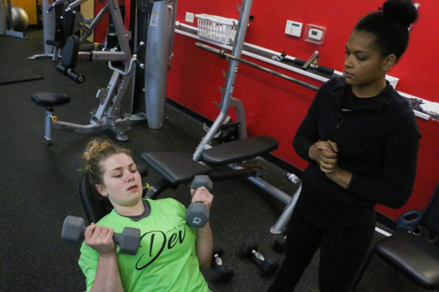 Devin Wilmott, personal trainer and 2017 graduate of Iowa State, works with Taylor Schumacher to help rebuild her strength after being diagnosed with postural orthostatic tachycardia syndrome (POTS). Wilmott modifies Schumachers exercises to where Schumacher is able to sit or lie down. The two have known each other since high school. I feel like our relationship has grown a lot, were good friends above anything else.