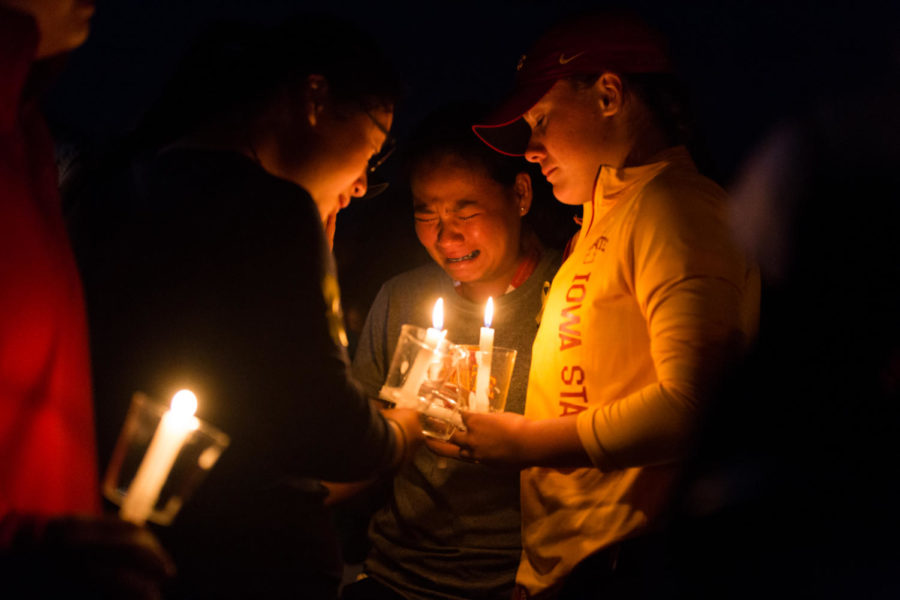 Members of the Iowa State community mourn Celia Barquín Arozamena during the candlelight vigil held in her honor Sept 19. the breaking point for many in attendance was the playing of her favorite songs as the candles were lit.