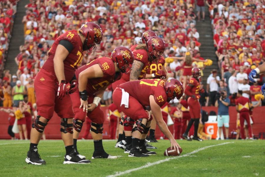 Members of the Iowa State Football team prepare for a play during the opening game against South Dakota State at Jack Trice Stadium on Sept. 1.