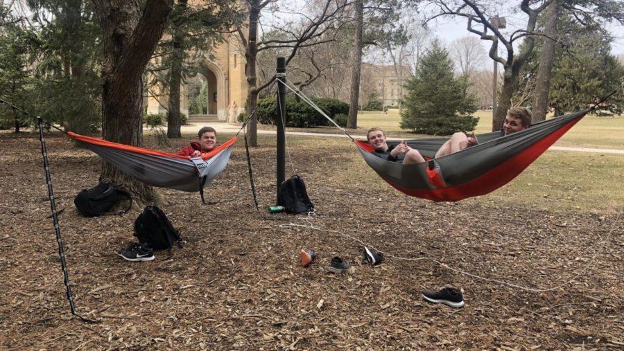 (Left to right) Joshua Caplinger, then-freshman in software engineering, Derek Wurth, then-freshman in psychology and Austin Hedgren, then-freshman in mechanical engineering, hammock and hang out while enjoying the first few days of spring weather March 28.