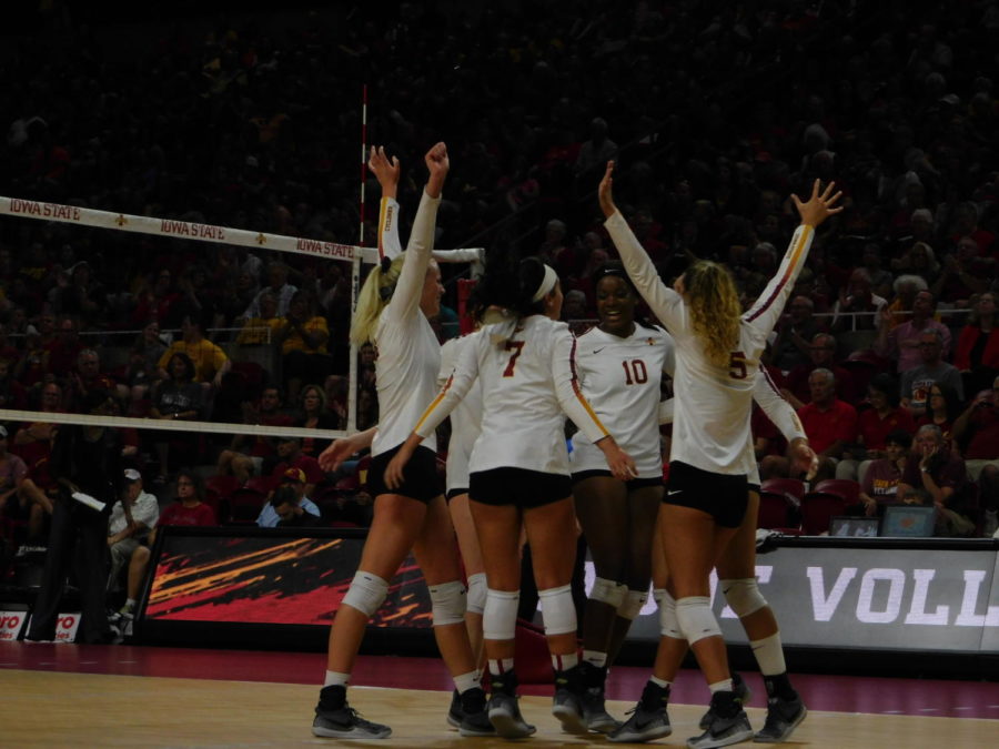 The Cyclones celebrate after scoring a point against the Iowa Hawkeyes in the home volleyball game Sept. 14, 2018. The Cyclones ended with a 3-1 loss against the Hawkeyes.
