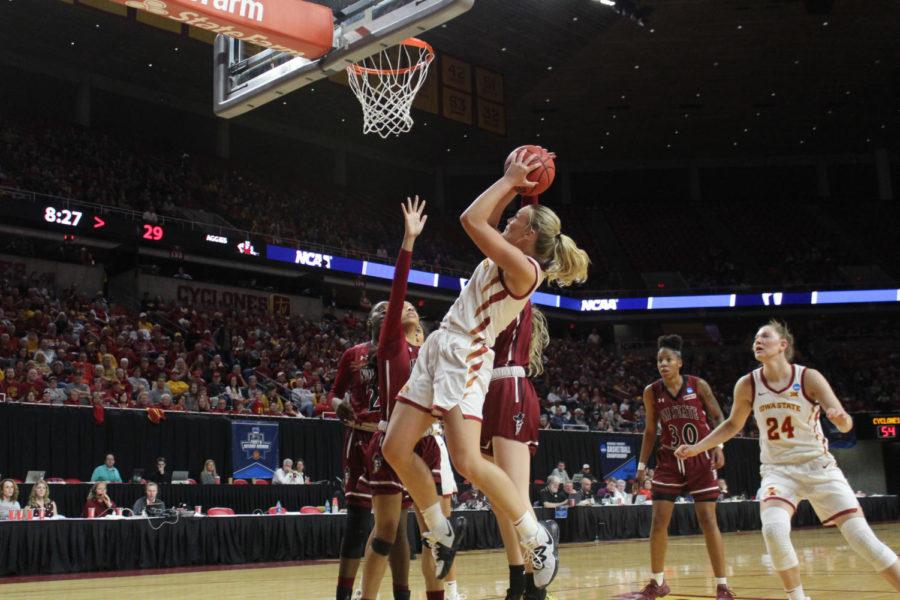 Sophomore forward Madison Wise shoots a successful layup after rebounding the ball from a missed three-pointer by redshirt senior guard Alexa Middleton. Wise played for a total of 28 minutes during the first round game. The Iowa State women’s basketball team won against New Mexico State 97-61 during the first round of the NCAA Tournament on March 23 held in Hilton Coliseum. The Cyclones will move on to play No. 11 seed Missouri State on Monday, March 25 in Hilton Coliseum.