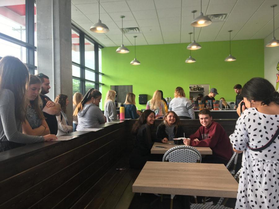 A line stretched around Big Açaí Thursday morning during its grand opening.