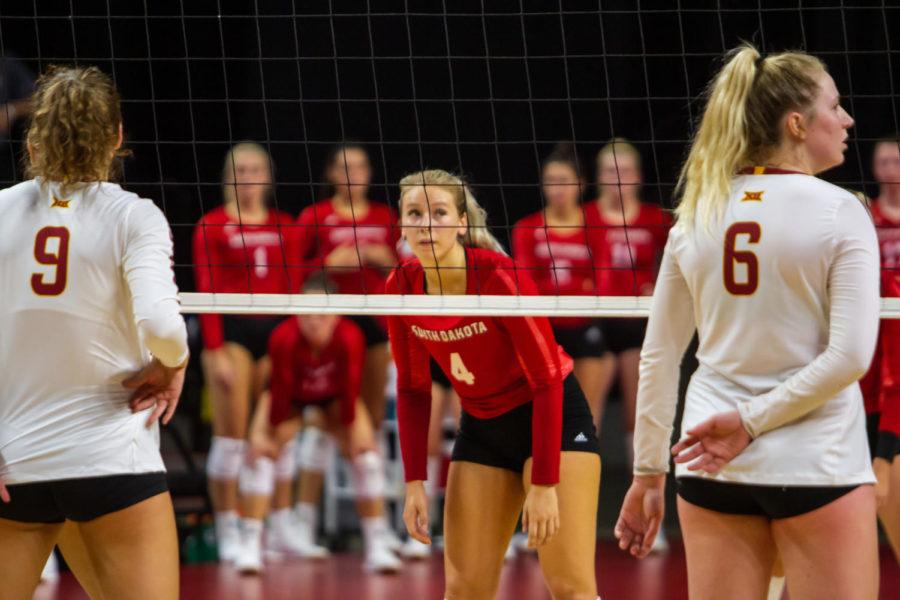 #9 Annie Hatch (left) and #6 Eleanor Holthaus prepare for their teams serve against South Dakota on Tuesday. Both Hatch and Holthaus have been major parts of the Iowa State attack this season, with both ranking in the top three for the team in kills.