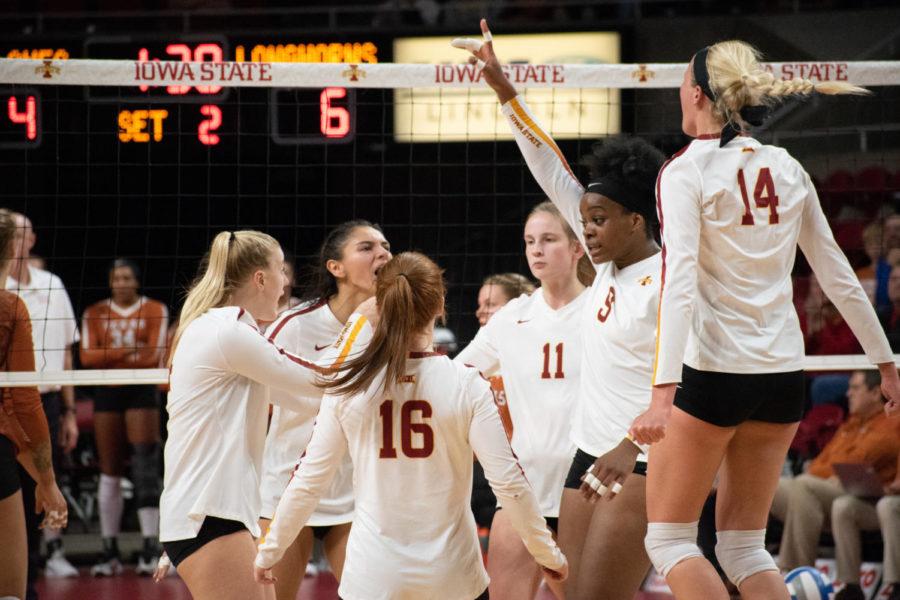 Cyclone+volleyball+players+celebrate+a+point+Oct.+24+at+Hilton+Coliseum.+The+Cyclones+lost+3-0+to+Texas.%C2%A0