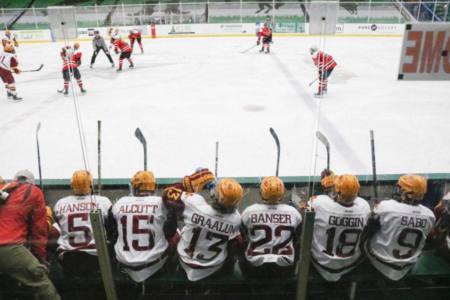 Several Cyclone Hockey players watch as the team plays in the ACHA National Tournament on March 27. Iowa State fell in the championship game.