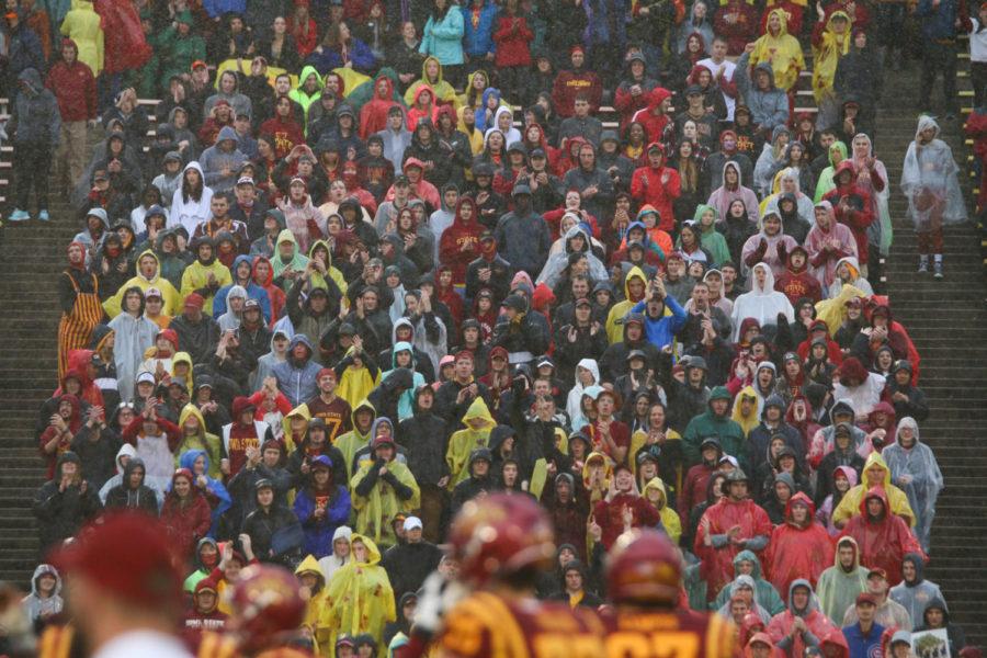 Fans brave the rain while cheering on the Cyclones in their game against Kansas on Oct. 14, 2017. The game was delayed 37 minutes due to a severe thunderstorm warning.