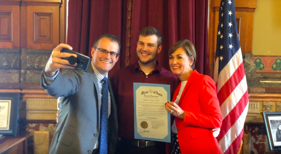 Carson King poses with Governor Kim Reynolds for a selfie at an event where she designated Sept. 27 as Carson King Day in Iowa by proclamation.