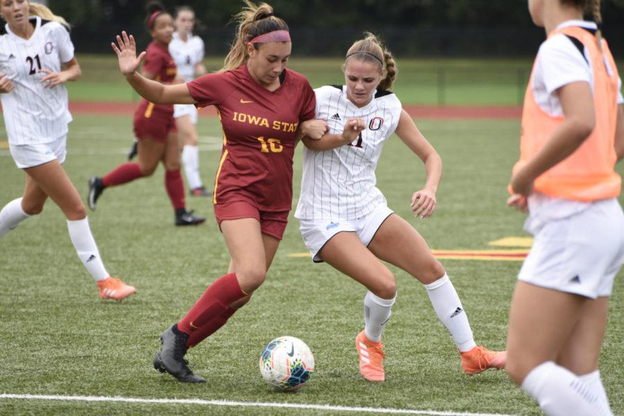 Then-redshirt freshman forward Kenady Adams jockeys with an Omaha player for the ball during a game Sept. 8, 2019. The Cyclones won 1-0.