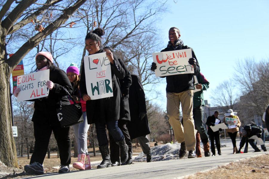 Student members of the Black Student Alliance, marched from the Multicultural Center to the front lawn of Parks Library while carrying signs on Jan. 28, at noon. In attendance was Senior Vice President for Student Affairs Dr. Thomas Hill. The event, coordinated by Teonna Flipping, a senior in speech communication, attracted passing students around campus.