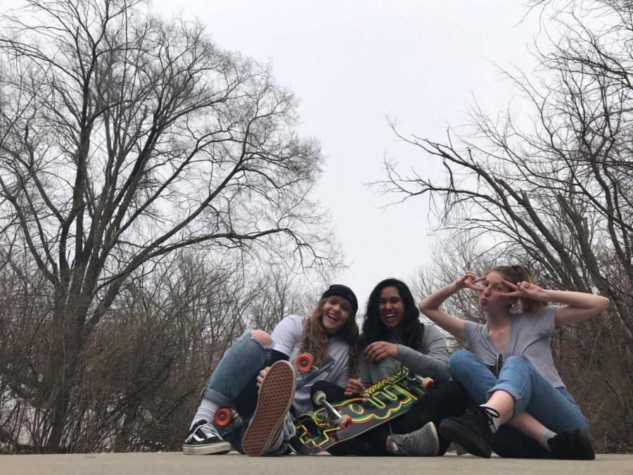 Longboarding is a popular method for students to get around campus, Kira Simmons (far right), a freshman hospitality management, said she likes the way it brings her friends together. 