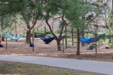 Students hammock near Campanile during their free time on April 16, 2019.