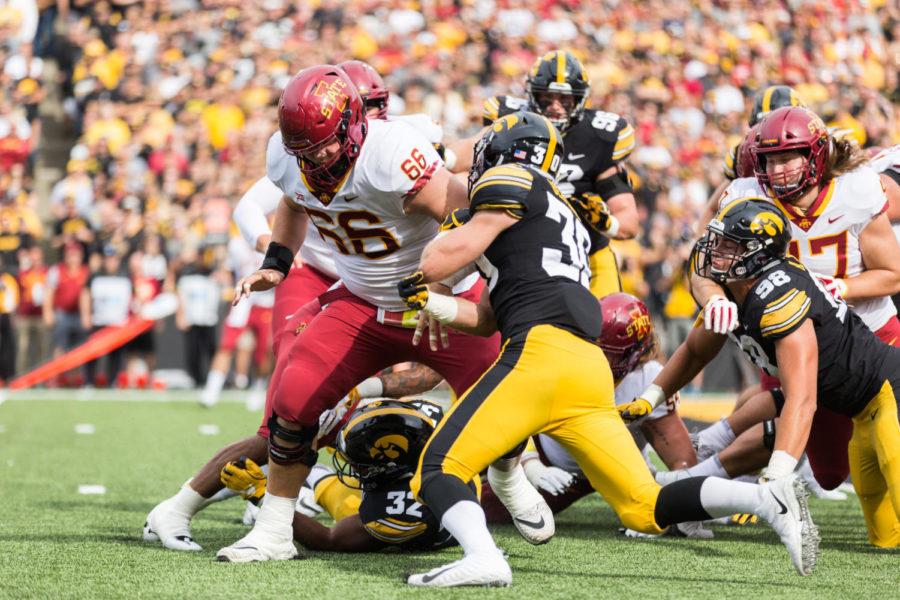 Then-junior Offensive Linemen Josh Knipfel blocks for the runner during the Iowa Corn Cy-Hawk Series game Sept. 8, 2018. The Hawkeyes defeated the Cyclones 13-3.