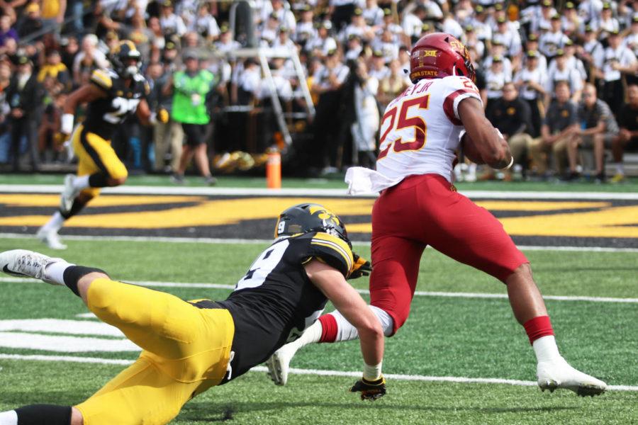 Running back Sheldon Croney Jr. runs the ball down the field during the football game against University of Iowa at Kinnick Stadium in Iowa City on Sept. 8. The Cyclones were defeated 13-3.