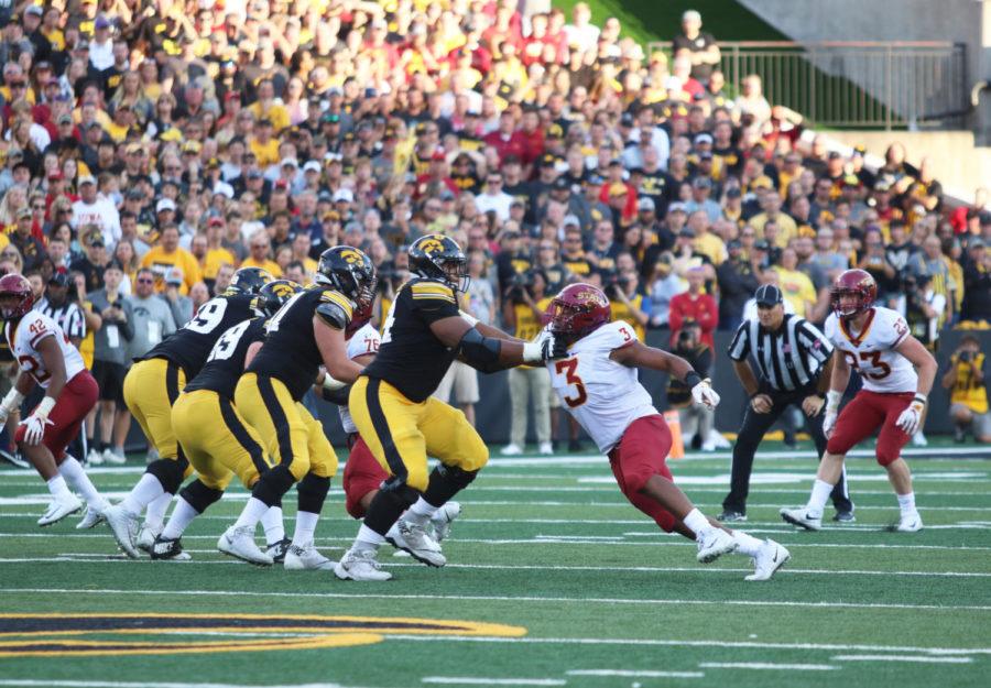 Defensive end JaQuan Bailey attempts to rush the passer against a member of the University of Iowa football team during the Sept. 8, 2018, game at Kinnick Stadium in Iowa City. Bailey was finished with eight sacks, which is the third best mark in program history.