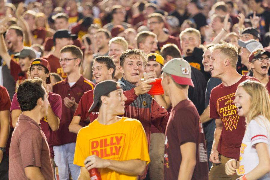 Iowa State Students wait out the rain delay during the Iowa State vs South Dakota football game with a game of frisbee. 