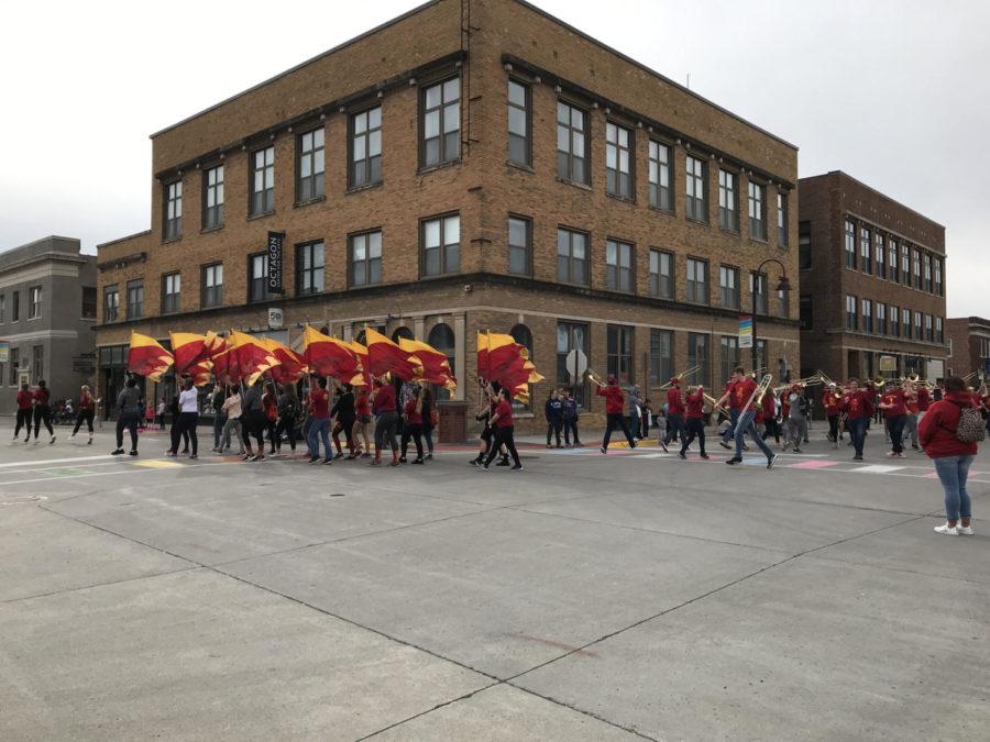 The Iowa State Marching Band and Color Guard played during the Homecoming Parade in downtown Ames on Sunday.