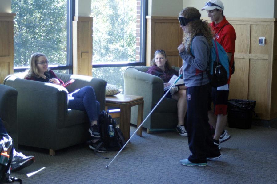 Elizabeth Meyer, then-sophomore in pre-business, tries walking with a white cane at the demonstration walk at UDCC in October 2016. Step Into My World was put on by the Alliance for Disability Awareness Club and the Student Disability Resource Center. The event was part of Disability Awareness Week in 2016.
