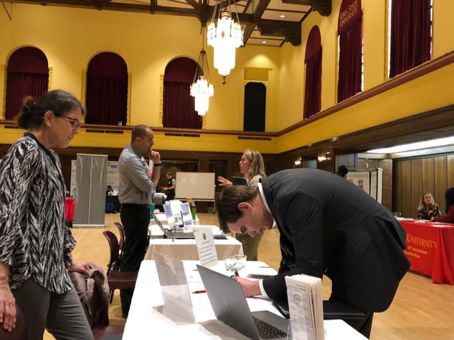 Michael Brown, senior in journalism and mass communications, interacts with one of the employers at the fall 2019 Greenlee Jump-Start Internship and Networking Fair.