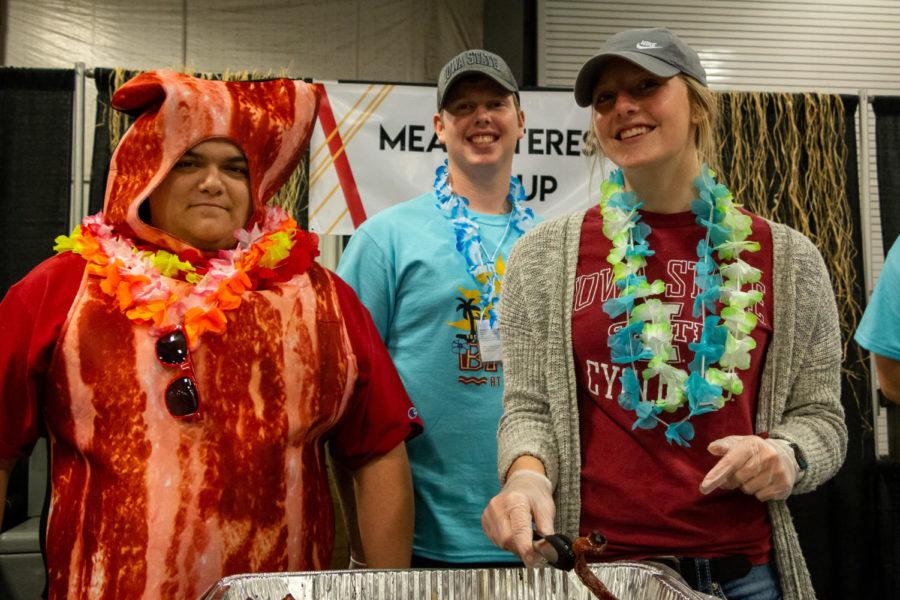 On Oct. 12, the Iowa State Bacon Expo hosted its seventh annual event for Iowa State students and their families to learn more about the swine industry and enjoy all kinds of bacon. Three members of the Block and Bridle Meat Interest Group prepare for a long line of bacon lovers.