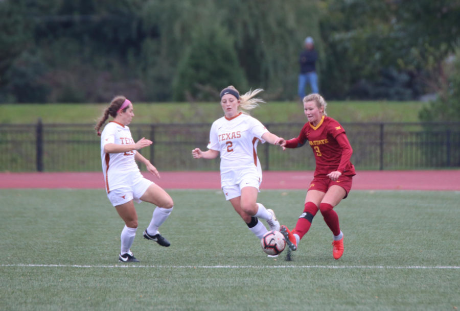 Defender Shealyn Sullivan tries to keep the ball out of reach from a University of Texas player during their game at the Cyclone Sports Complex on Oct. 5. The Cyclone lost 2-1 after playing the first half in the rain.