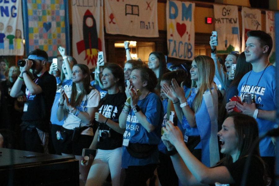 People in the audience react to Dance Marathon participants cutting their hair to donate to make wigs. The 22nd annual Dance Marathon was Jan. 26 in the Great Hall of the Memorial Union. Dance Marathon is a fundraiser where all the money raised is directly given to University of Iowa Children’s Hospital through Children’s Miracle Network.