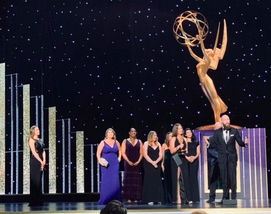 Madison Tuttle, Iowa State alumna, and other contributors to NASAs interactive broadcast receive an Emmy award for their achievements. 