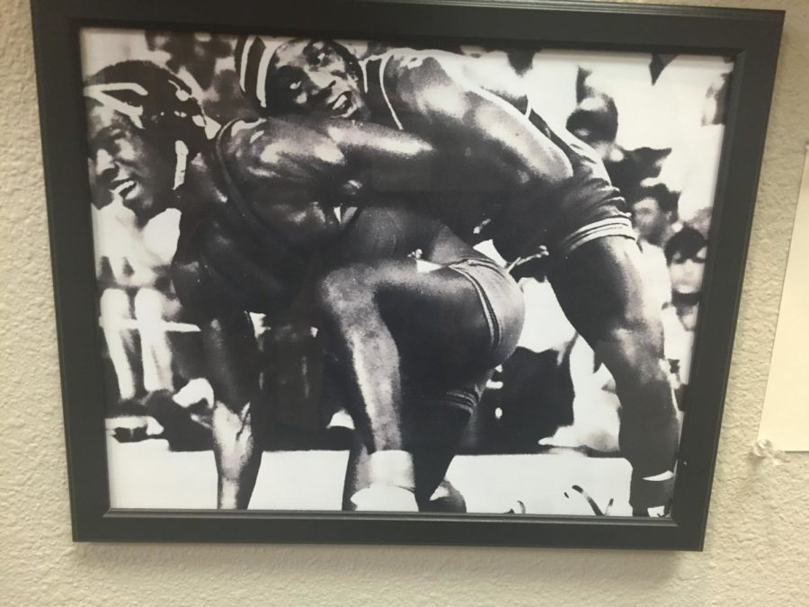 A photo of Nate Carr wrestling hangs in the National Wrestling Hall of Fame Dan Gable Museum in Waterloo, Iowa. Carr wrestled for Iowa State in the early 80s.