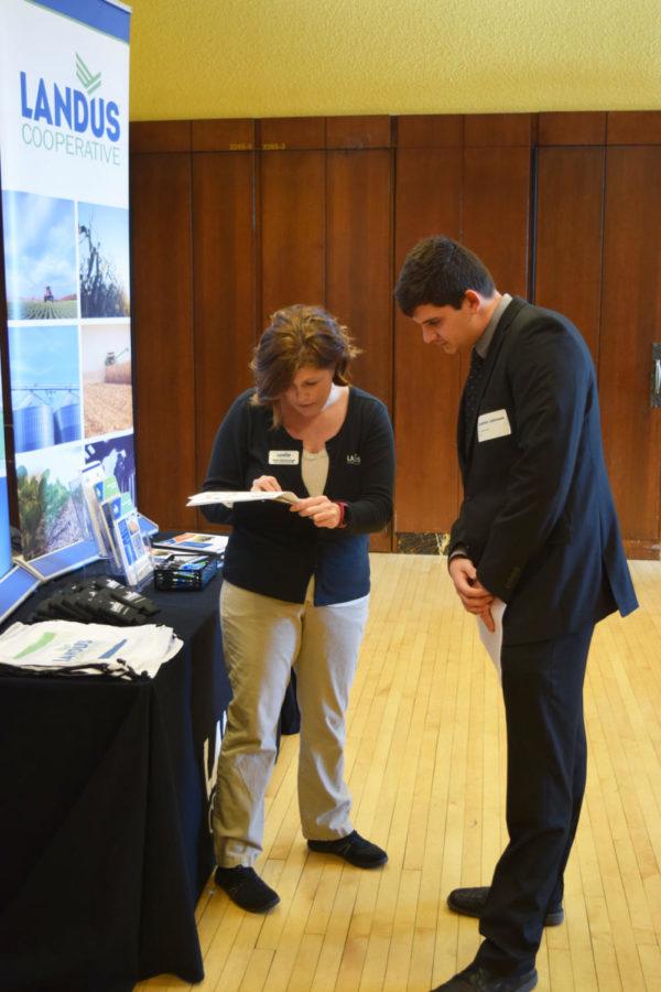Jonathon Johnson, then-junior in animal science, speaks with a representative from Landus Cooperative, one of the 101 businesses that came to the College of Agriculture and Life Sciences Career Fair. The fair lasted from 10 a.m. to 2 p.m. on Feb. 1, 2017, in the Great Hall of the Memorial Union. 