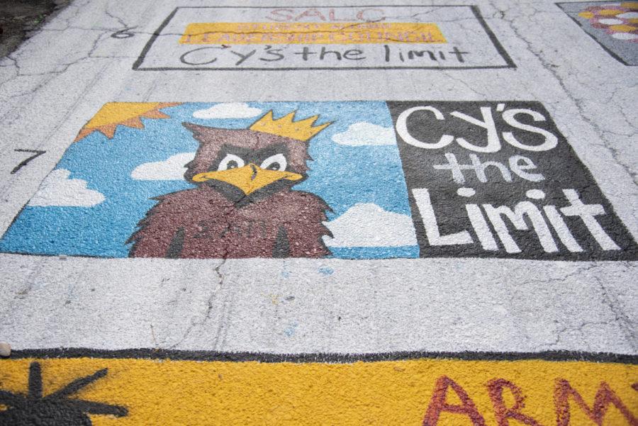 Painting Victory Lane is one of the returning Homecoming events this year. One section of Victory Lane depicts the 2019 Homecoming theme, “Cy’s the Limit” with Cy painted in front of a sky background.