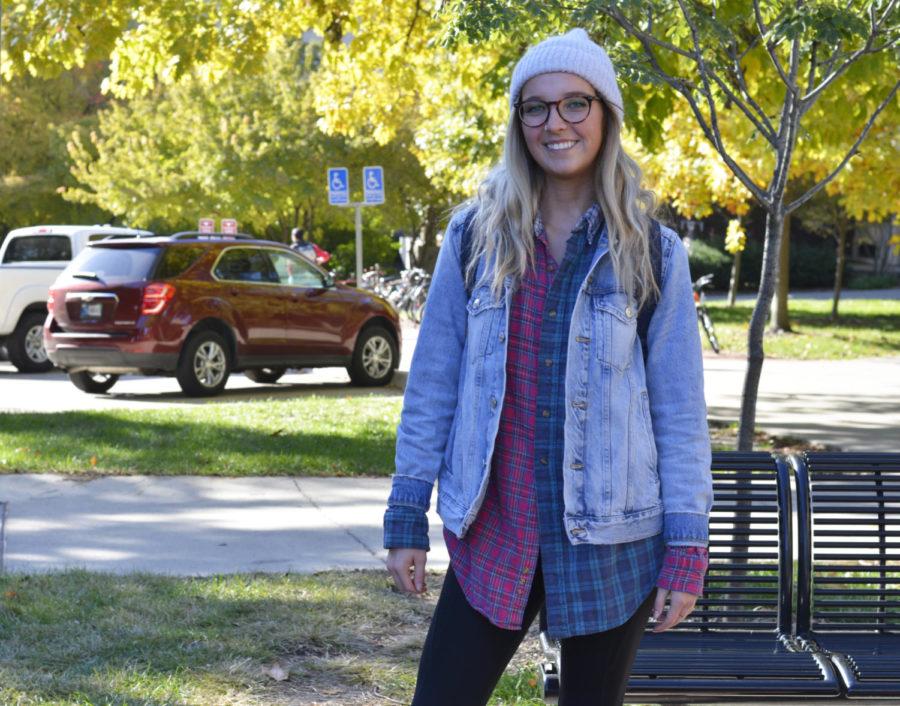 Delaney Goldsworthy shows off her style on campus. She layered a denim jacket and patterned button down over black leggings.