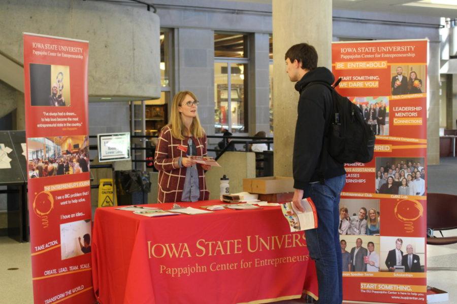 Diana Wright, marketing and program coordinator for the ISU Pappajohn Center for Entrepreneurship, talks to Michael Seymour, senior in mechanical engineering, about the entrepreneurship opportunities offered through the ISU Pappajohn Center on Oct. 15, 2018, in Parks Library. This event took place during Women Entrepreneurship Week, where different entrepreneurship activities happened on campus.