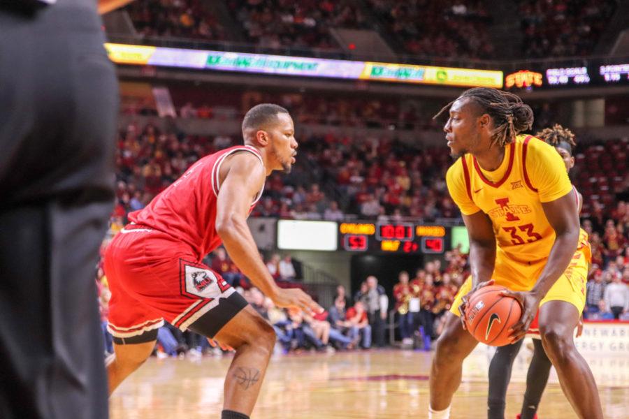 Junior forward Solomon Young tries to get past a defender during Iowa State’s 70-52 victory over Northern Illinois on Nov. 12 at Hilton Coliseum.