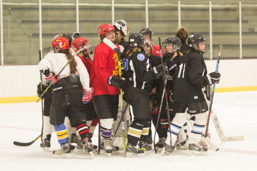 All the members of  the Iowa State Women’s Club Hockey Team come together before leaving the ice at the end of practice Sep. 14 at the Ames Ice Arena.