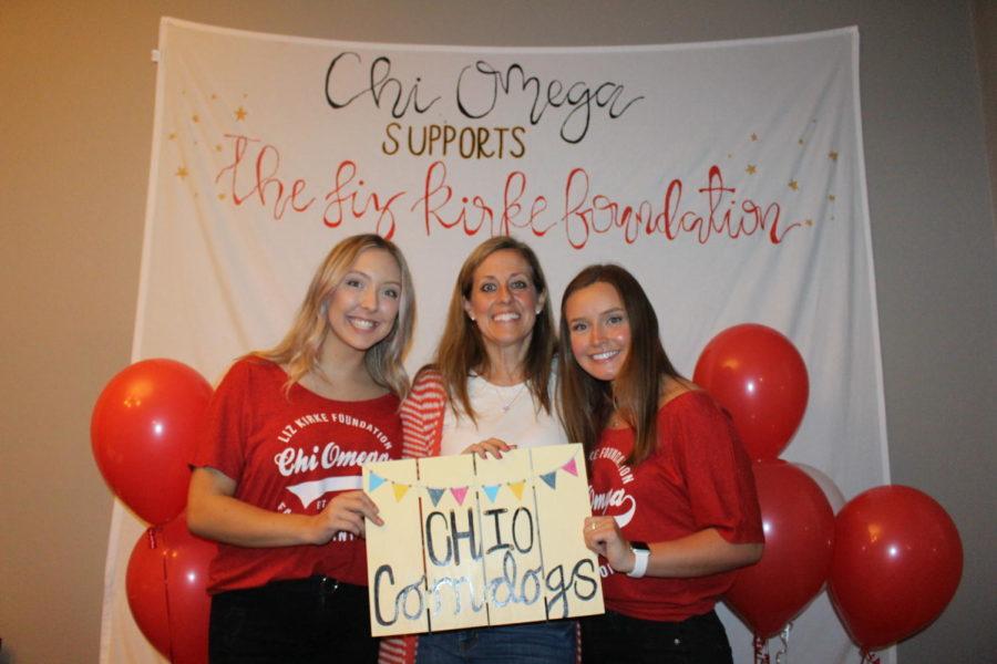 Chi Omega members pose with Liz Kirkes sister, Katie Wengert, at Chi O Corndogs on Oct. 10. Chi O Corndogs was Chi Omegas annual philanthropy event in support of the Liz Kirke Foundation. 