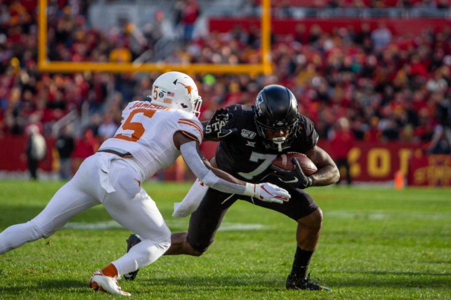 Wide receiver LaMichael Pettway dodges defenders against University of Texas on Saturday at Jack Trice Stadium. The Cyclones beat the Longhorns 23-21.
