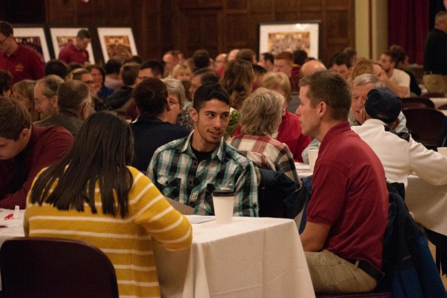 Iowa State students socializing during the Veterans Center Community Supper on Nov. 14, 2018 to celebrate veterans and their family members. This event was held at 5 p.m. in the Great Hall of the Memorial Union.