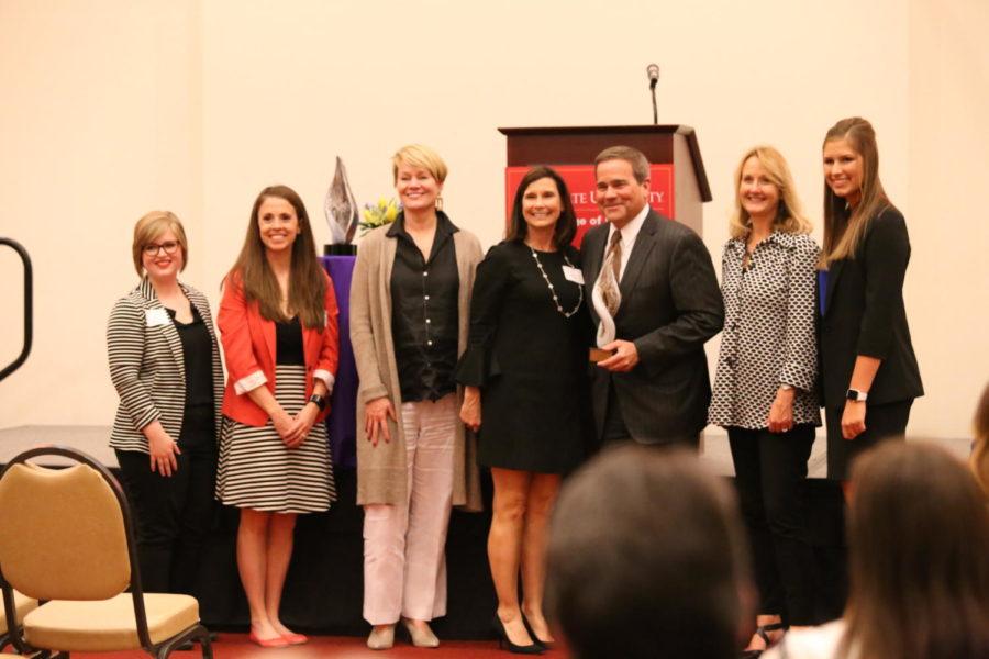 Dan Houston, chairman, president and CEO of Principal, accepts the Champion Award surrounded by women who work at Principal. The 2019 Ivy Women in Business Awards was hosted March 27 in the Alumni Center.
