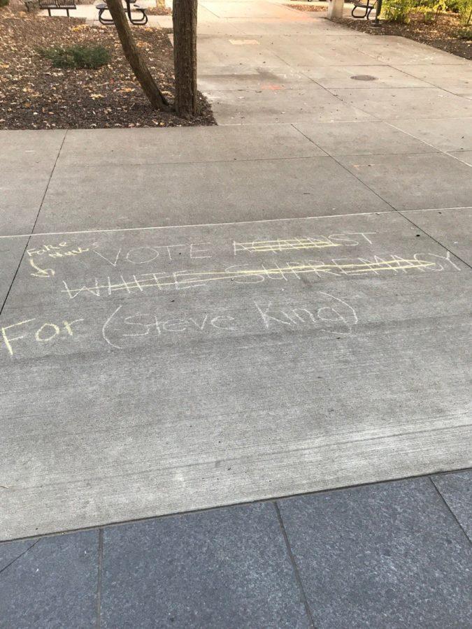Chalk messages denouncing white supremacy and Rep. Steve King were crossed out in favor of messages supporting King. These messages come at the same time when fliers saying Its okay to be white were found on campus in November 2018.