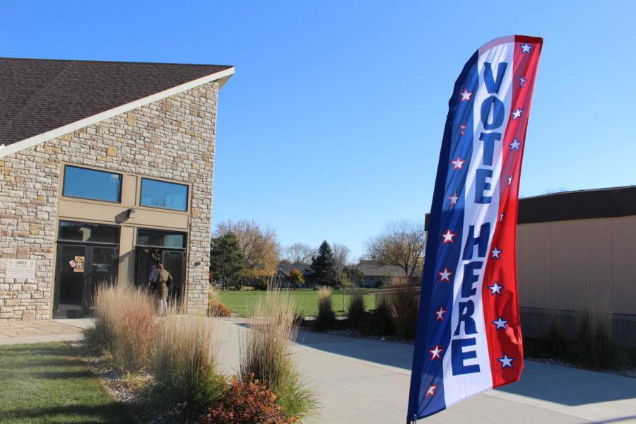 A Vote Here sign waves in the wind in front of the Ascension Lutheran Church where Ames residents cast their ballot on Nov. 8, 2016.