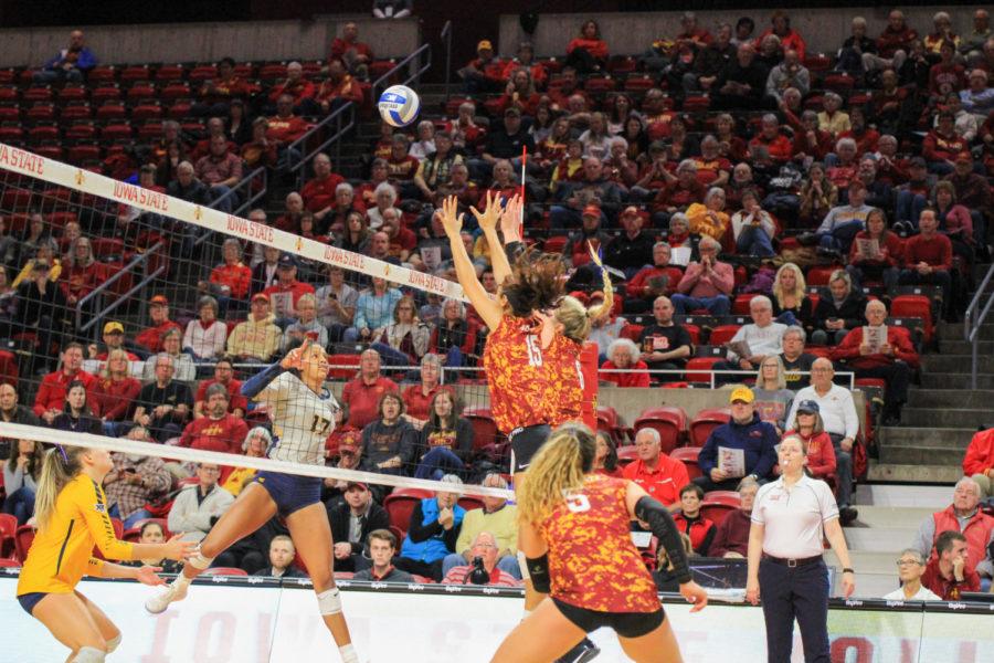 Avery Rhodes and Eleanor Holthaus go up for a block against West Virginia. Iowa State's volleyball team faced West Virginia on Nov. 6. Iowa State won 3-0.