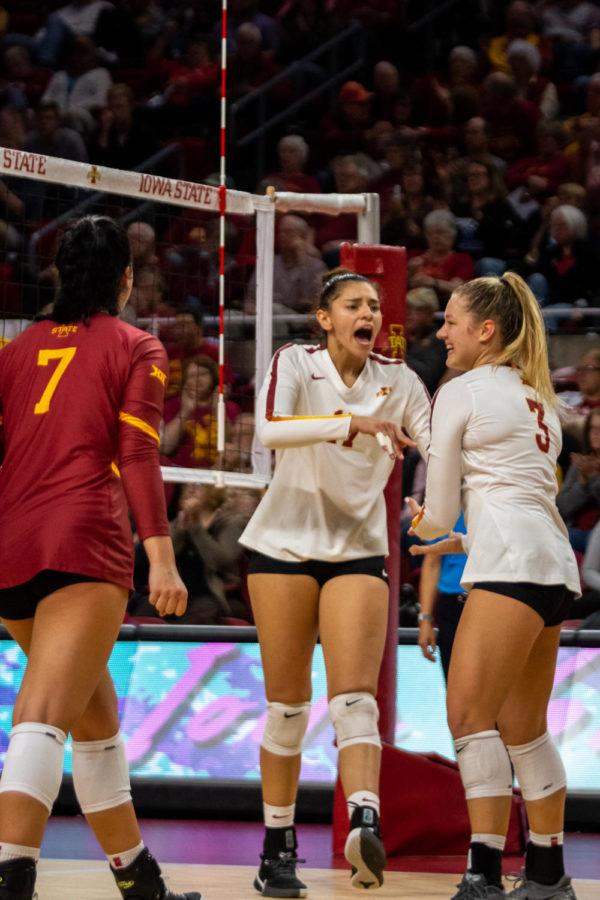 Candelaria+Herrera%C2%A0with+a+couple%C2%A0Iowa+State+volleyball+players+versus+Kansas+on+Oct.+2%2C+2019.
